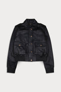 A black leather jacket  button-up front, and two front flap pockets with brass-tone snaps. Amelia -Sly&Co