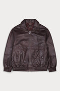 A dark brown leather jacket with a front zipper, ribbed elastic cuffs and hem, and zippered front pockets.
