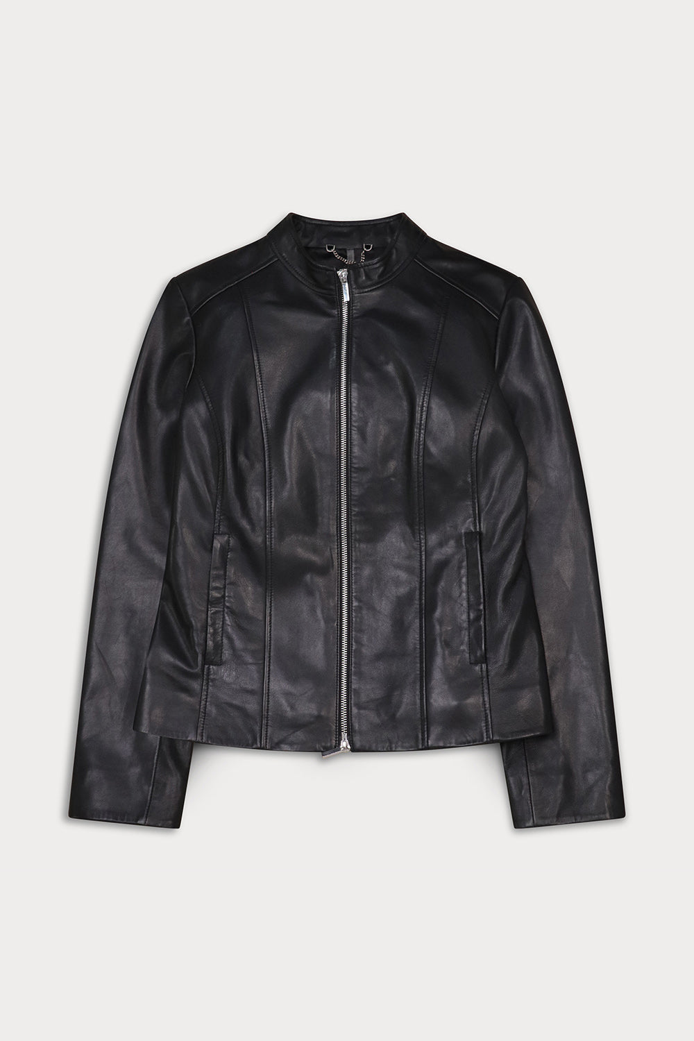 A black faux-leather jacket with a silver front zipper, stand-up collar, and zippered hand pockets.