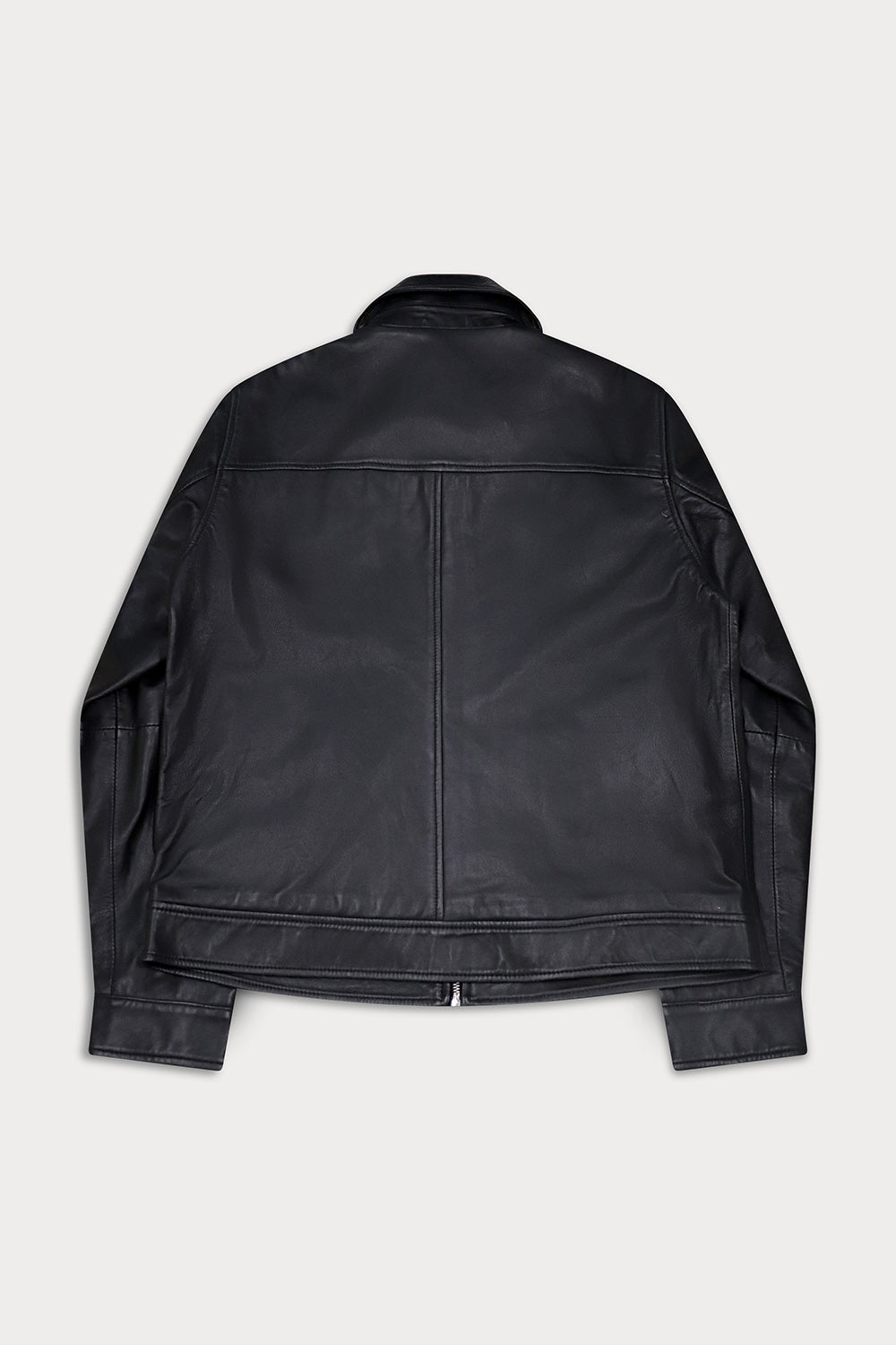 A black leather jacket shown from the back, featuring a smooth texture and a central seam