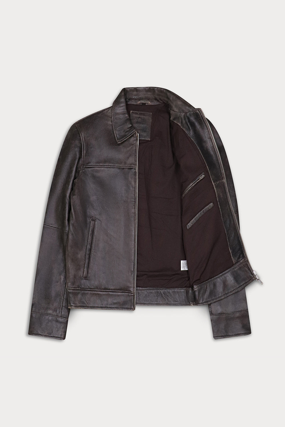 A dark brown distressed leather jacket with a dark brown interior lining, displayed open against a light gray background.