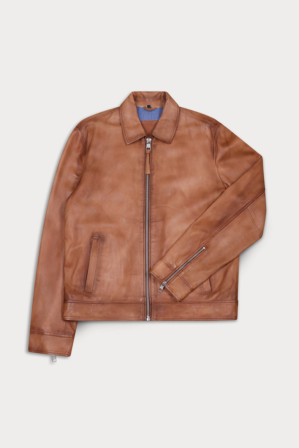 A brown leather jacket with a front zipper, zippered sleeve, and side pockets.