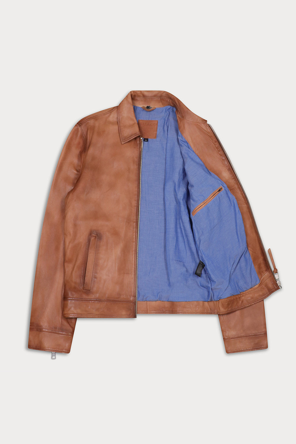 A brown leather jacket with a blue fabric lining.