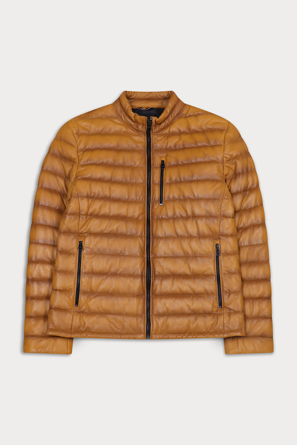 A mustard quilted puffer jacket with a stand-up collar, front zipper, and zippered pockets. Lewis - Sly&Co.