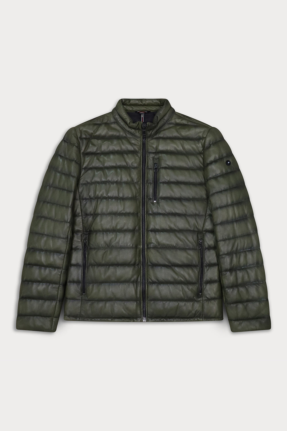 A green quilted puffer jacket with a stand-up collar, front zipper, and zippered pockets. Lewis - Sly&Co.