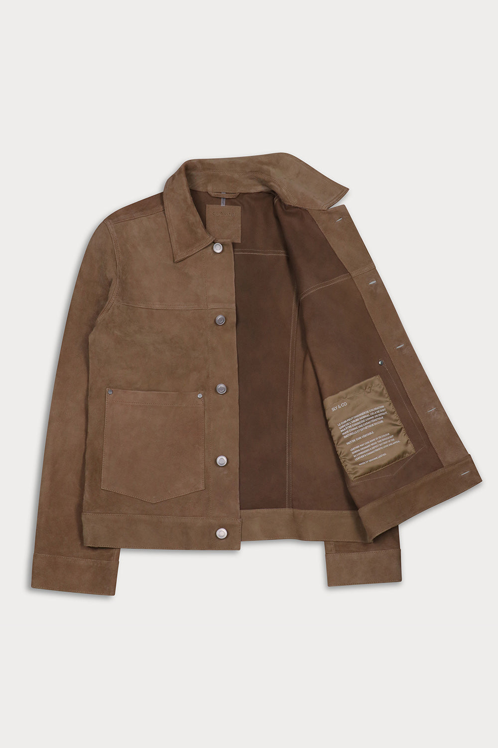 A suede jacket with a button-up front, pointed collar, and two front flap pockets, open.