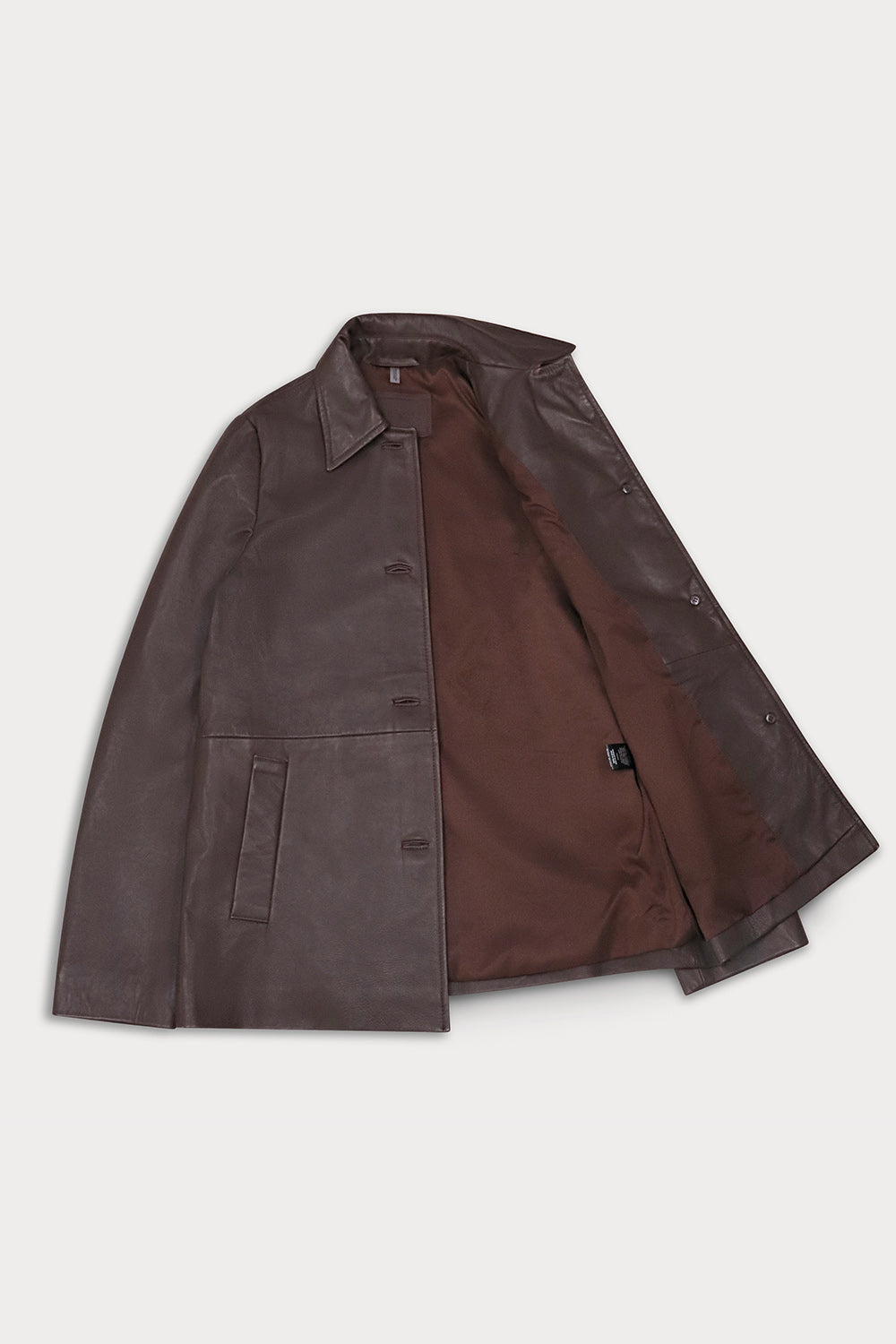 A dark brown leather jacket with a matching brown satin lining.