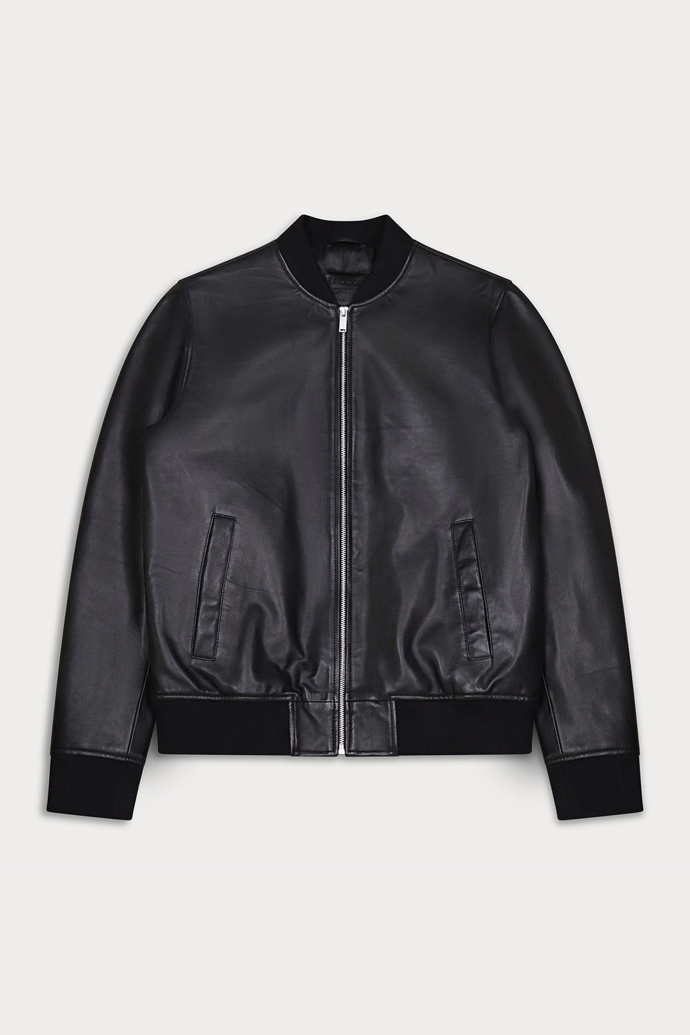 A black leather bomber jacket with a silver front zipper, ribbed collar, cuffs, and hem, displayed flat against a light gray background.