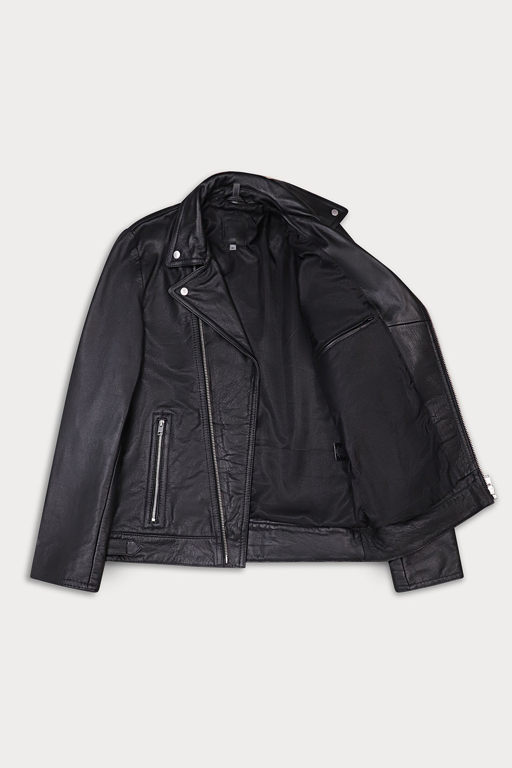 A black leather motorcycle jacket with a zippered front, angled snap collar, and zippered side pockets.