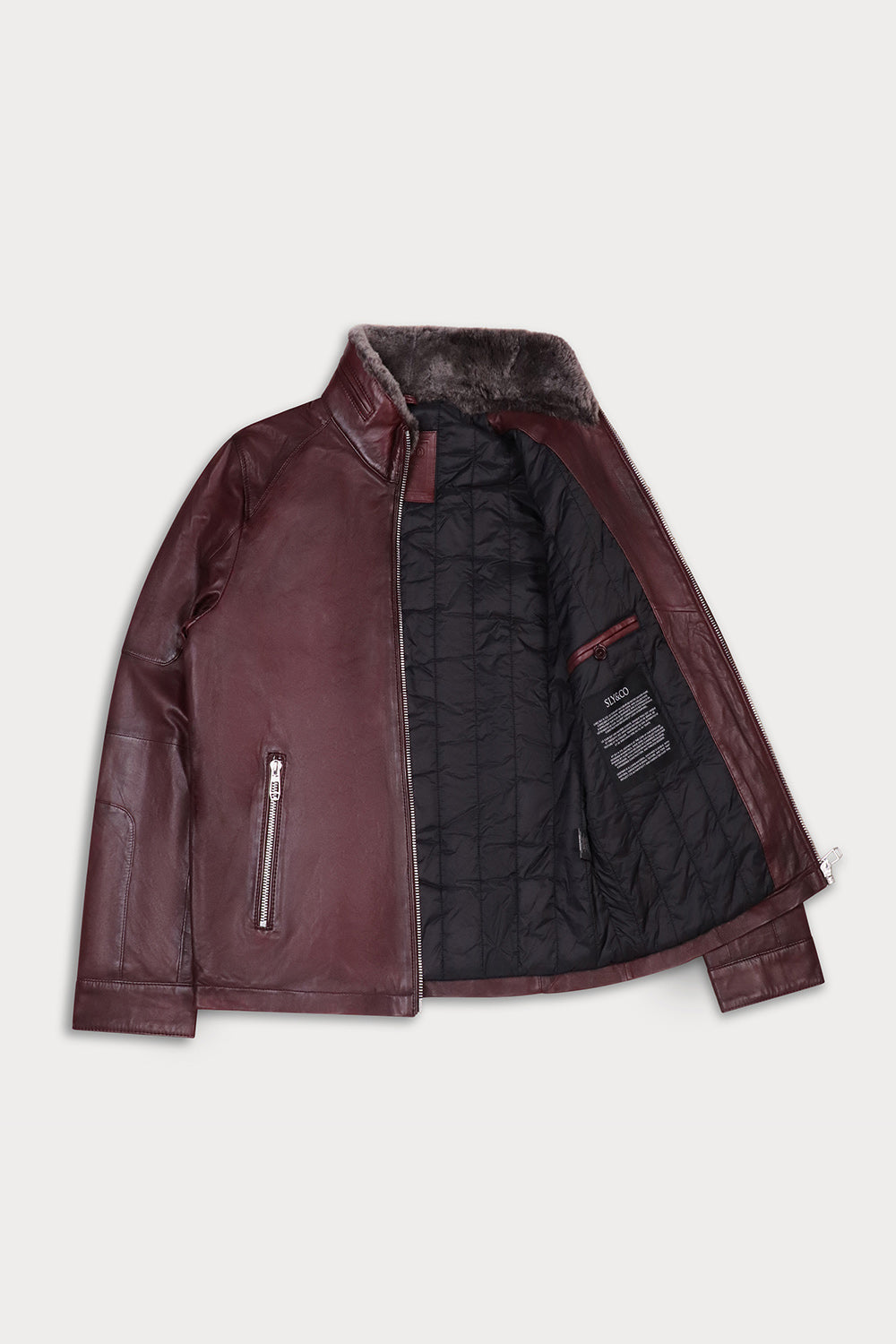 A dark burgundy leather jacket with a black quilted interior lining and a brown faux-fur collar.