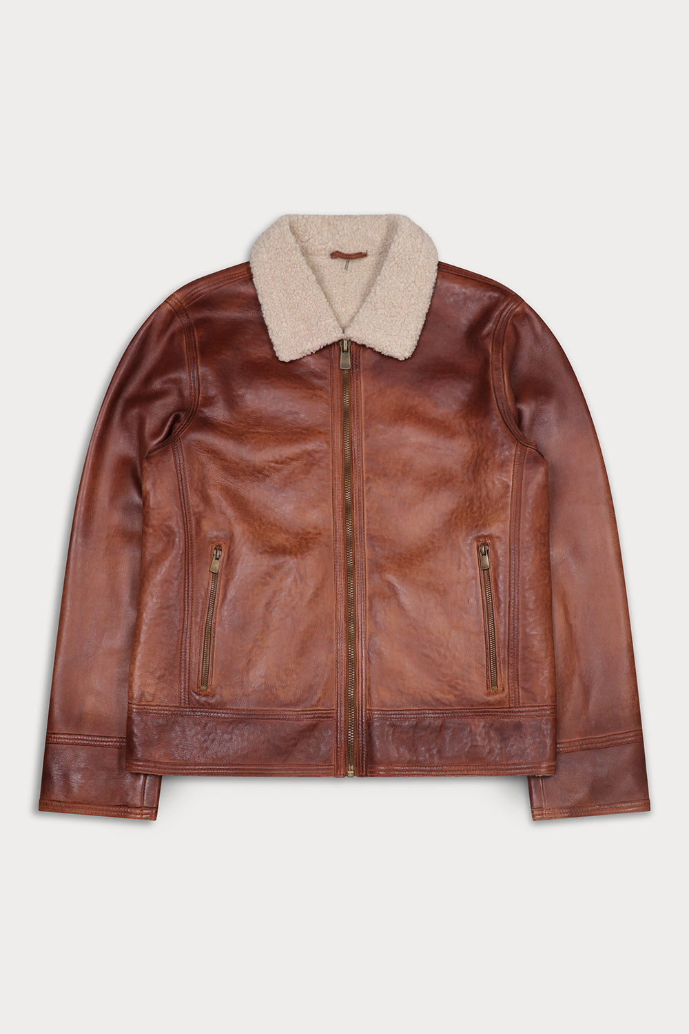 A brown leather aviator-style jacket with a beige sherpa collar, displayed flat against a light gray background.