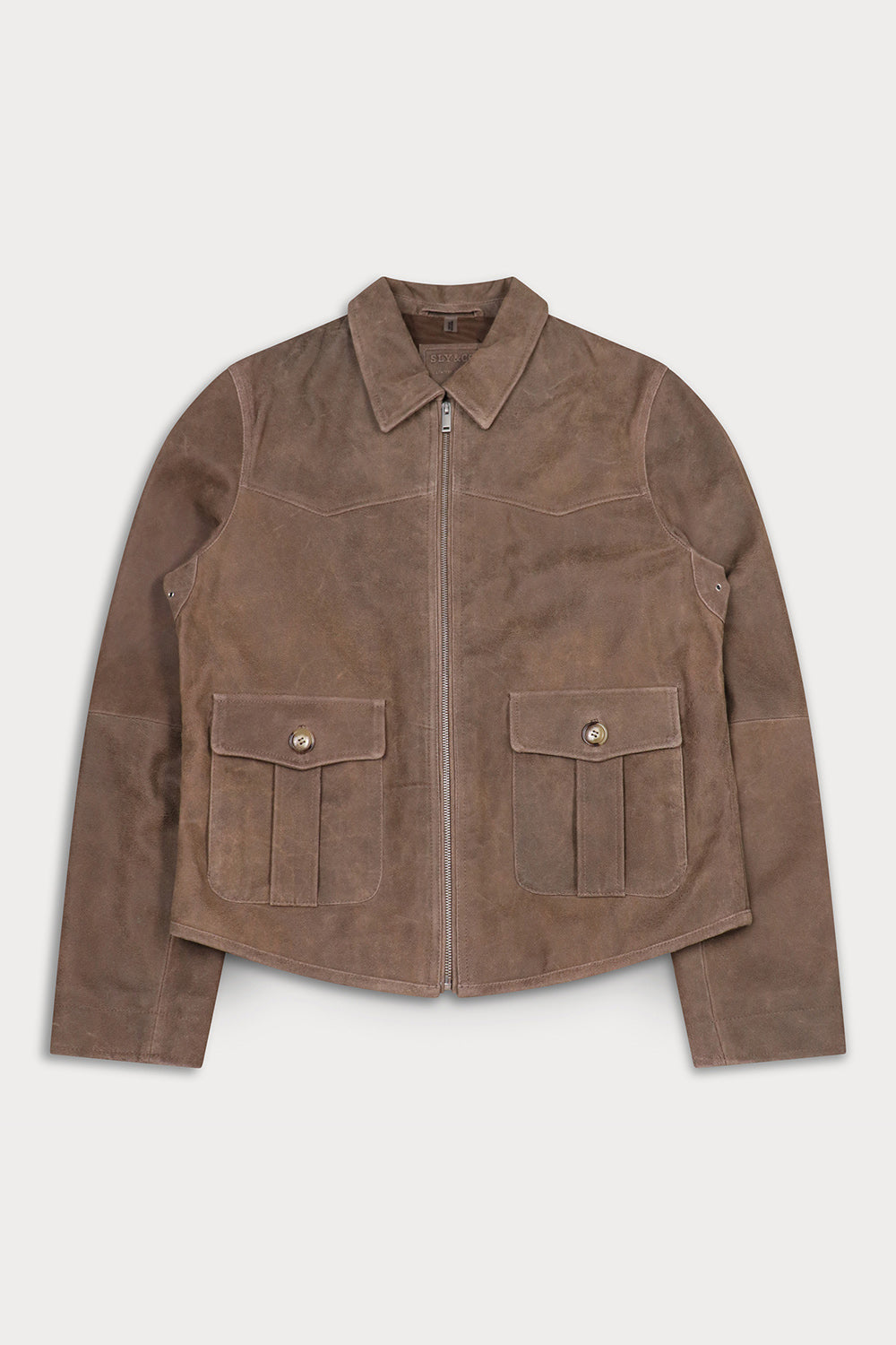 A brown suede jacket with a pointed collar, front zipper, and two large buttoned flap pockets on the chest.