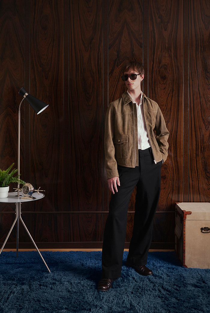 A model wearing a brown suede jacket, from Sly&Co.